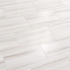 Daltile QuicTile 12 In. X 24 In. Horizon Marble Lappato Color Body Porcelain Locking Floor Tile (9.6 Sq. Ft. / Case) 25 Daltile QuicTile 12 In. X 24 In. Horizon Marble Lappato Color Body Porcelain Locking Floor Tile (9.6 Sq. Ft. / Case) -Best Flooring Store e352a1c4f0cd40dfa2d4e854d70da985 1800x1800